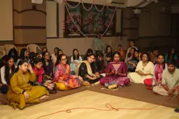 Alumni seated together during the Ekadashi kirtan