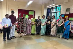 Participants posing together at a school celebration
